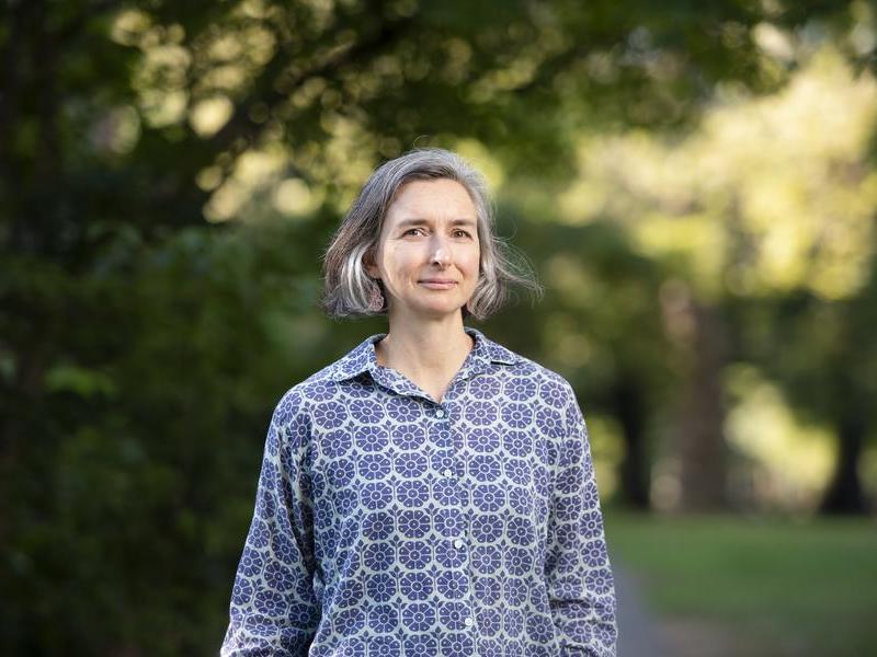 Photo portrait of Professor Jennifer Heath standing outside with trees in the background