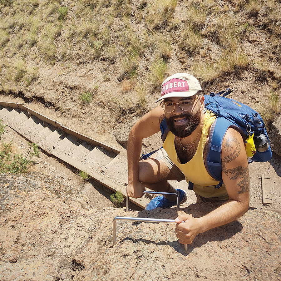 Pablo Brito at the top of a long stairway hike