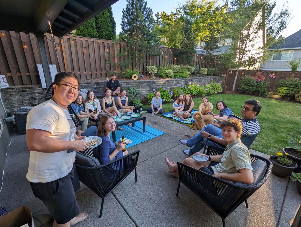 Students at a backyard barbecue