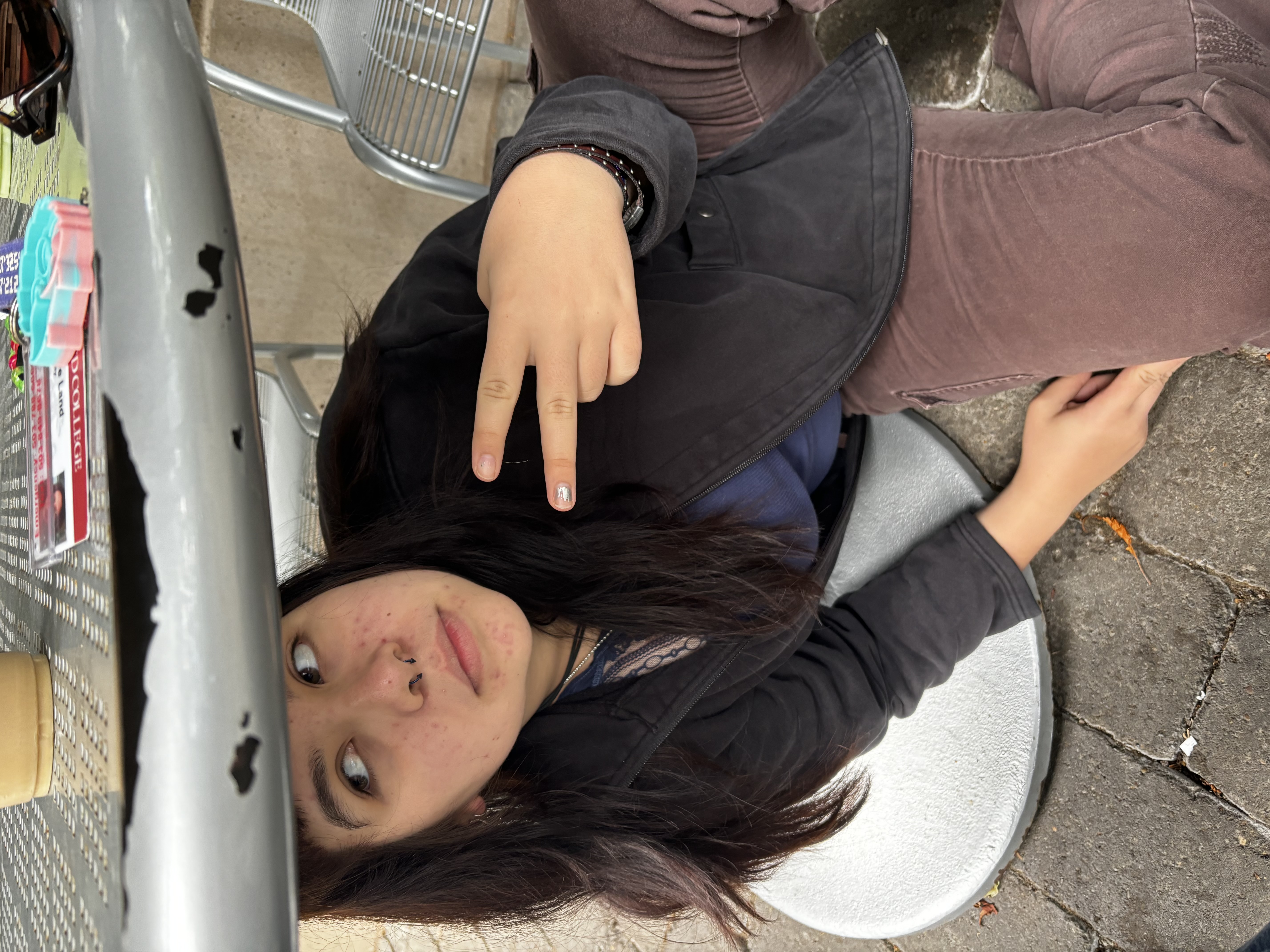 Bella underneath an outdoor table