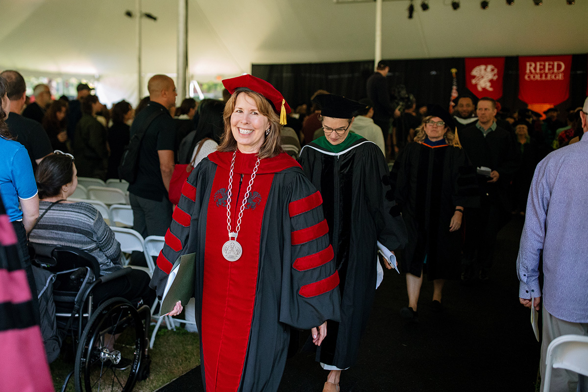 Reed President Audrey Bilger exiting the Convocation tent after the ceremony