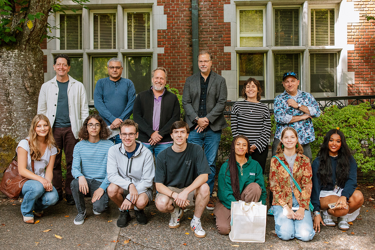 A group of Reed families posing together in front of Eliot Hall