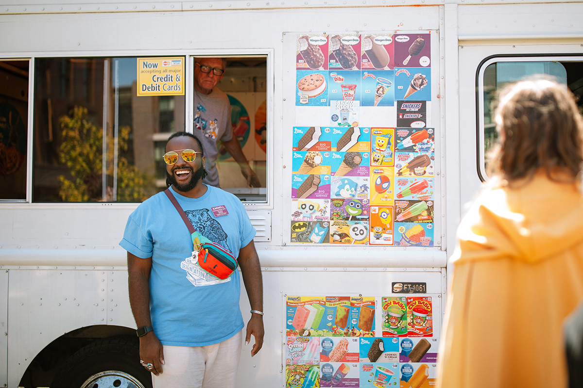 Vice President of Student Life Karnell McConnell-Black outide an ice cream truck on campus