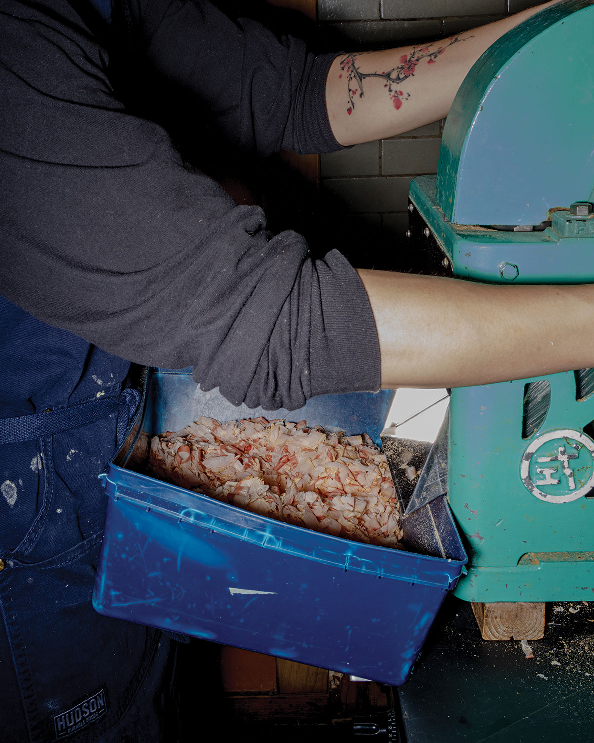 benito flakes with the Katsuobushi machine, which Sylvan says is the heart of his restaurant