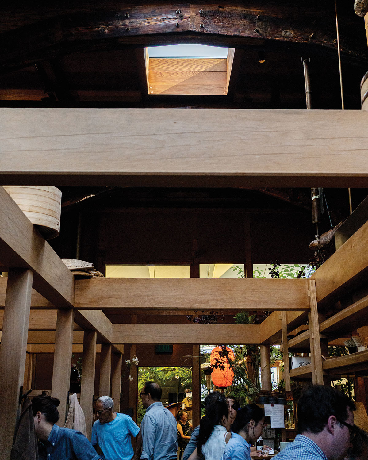 interior of Rintaro with wood beams and wood surrounding skylight